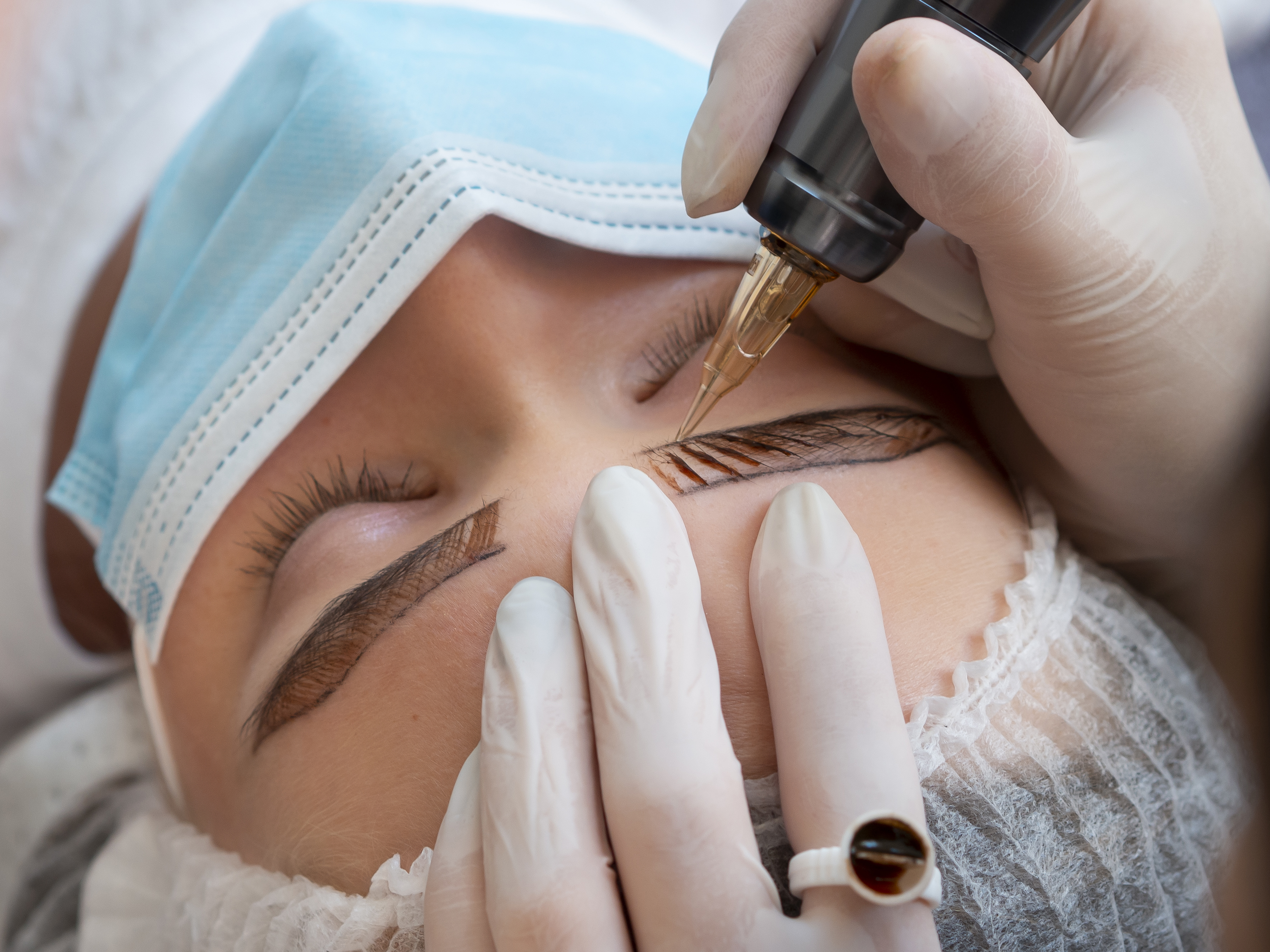 female client going through microblading treatment