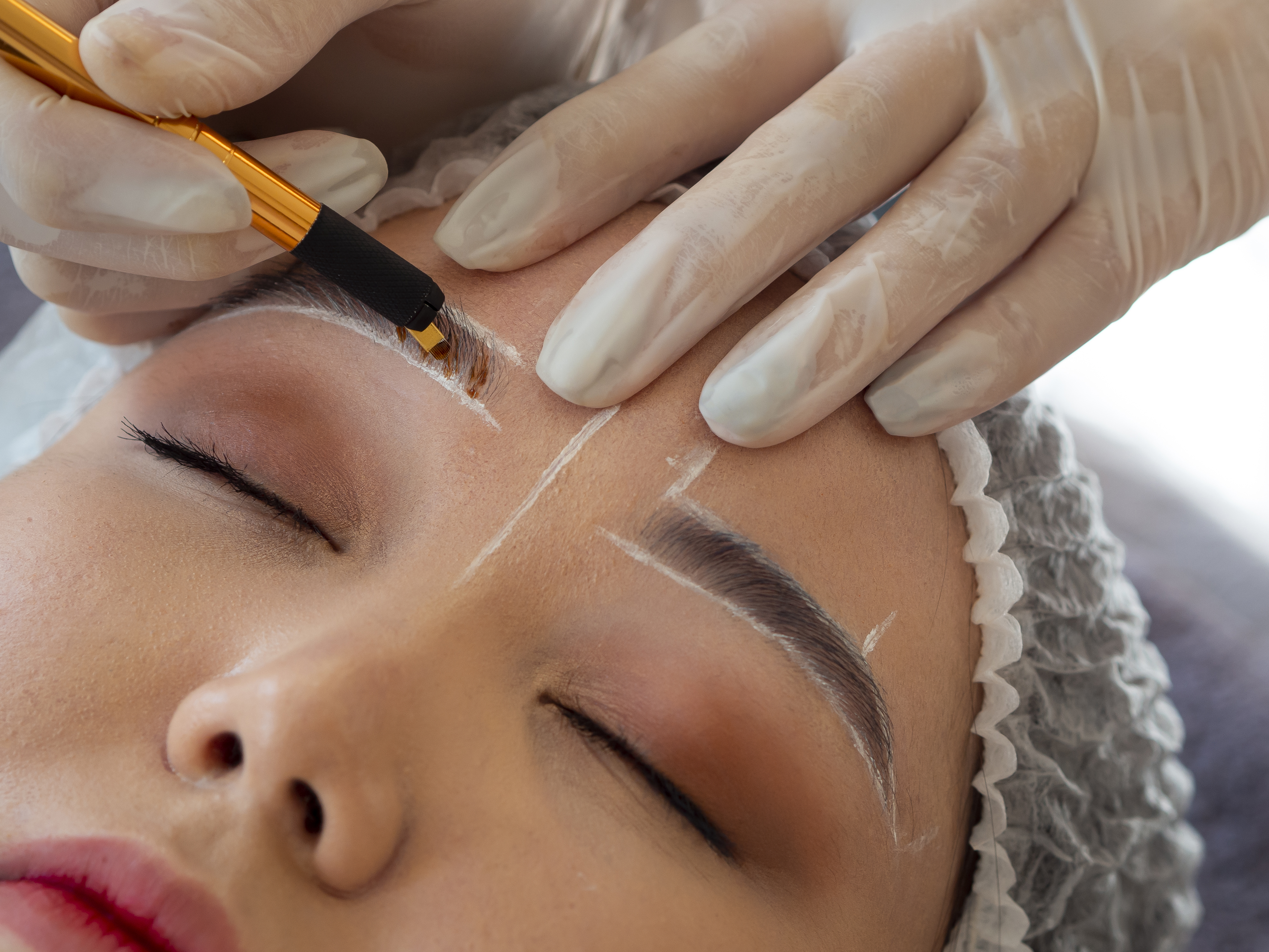 young woman going through microblading procedure